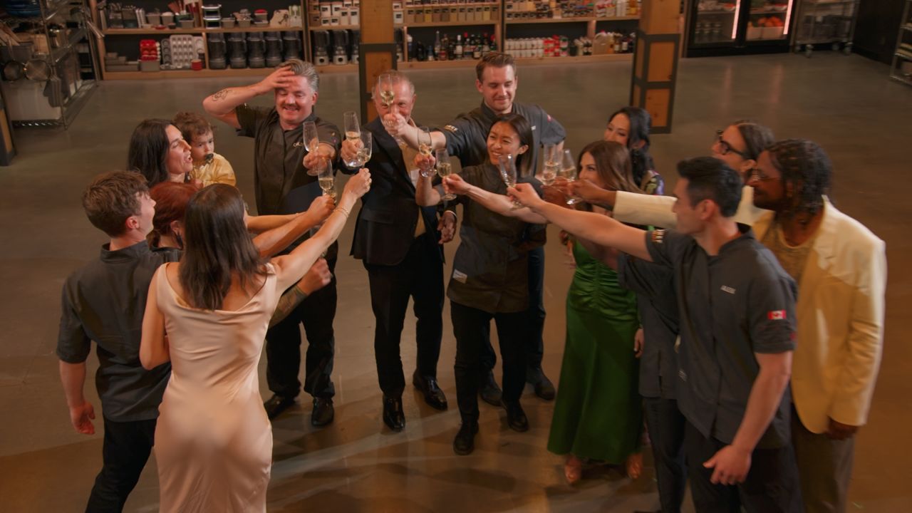 The Top Chef Canada contestants and judges raise glasses to winner Coulson Armstrong