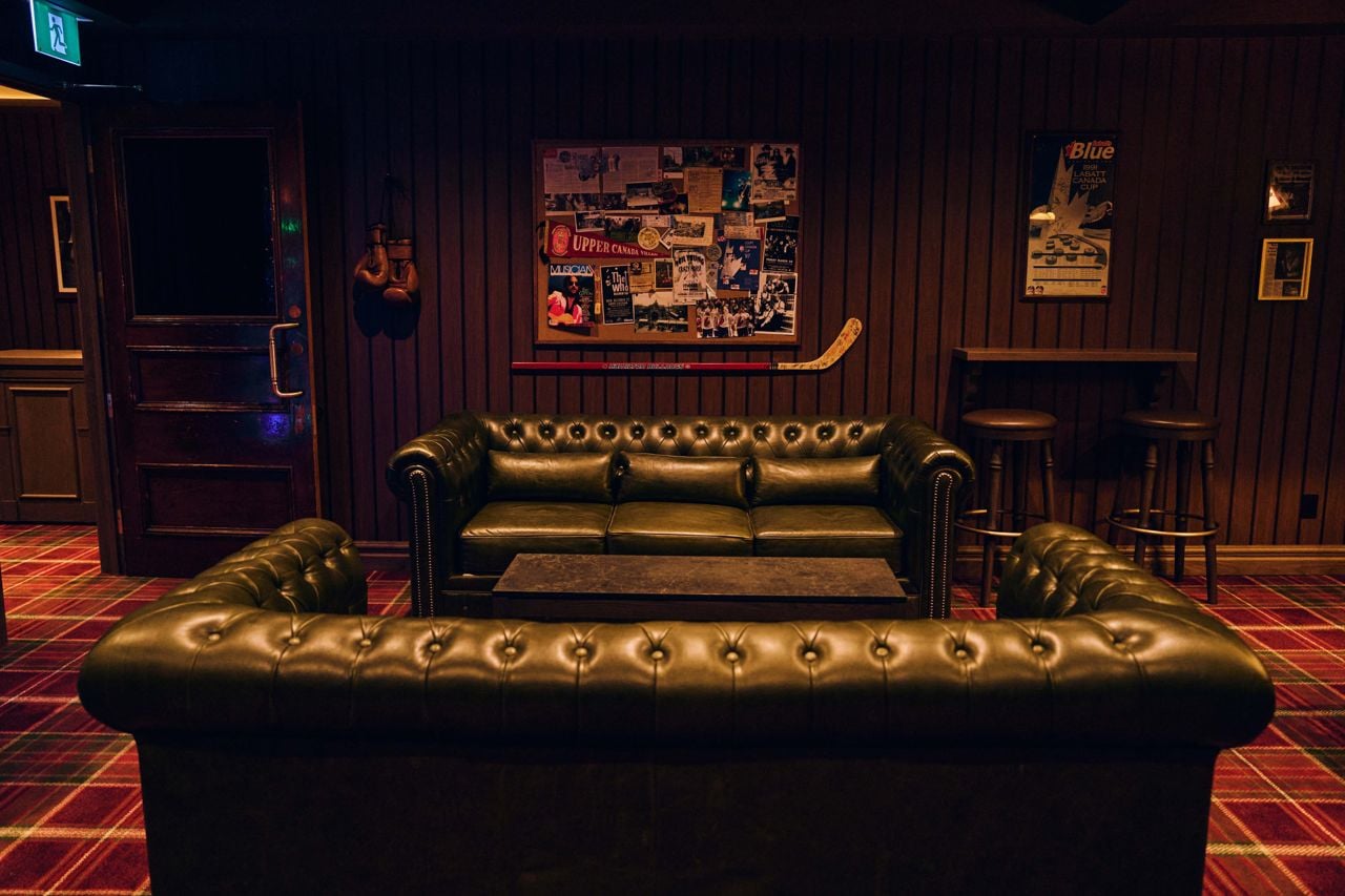 Leather couches in the billiards room of the Iron Cow Public house