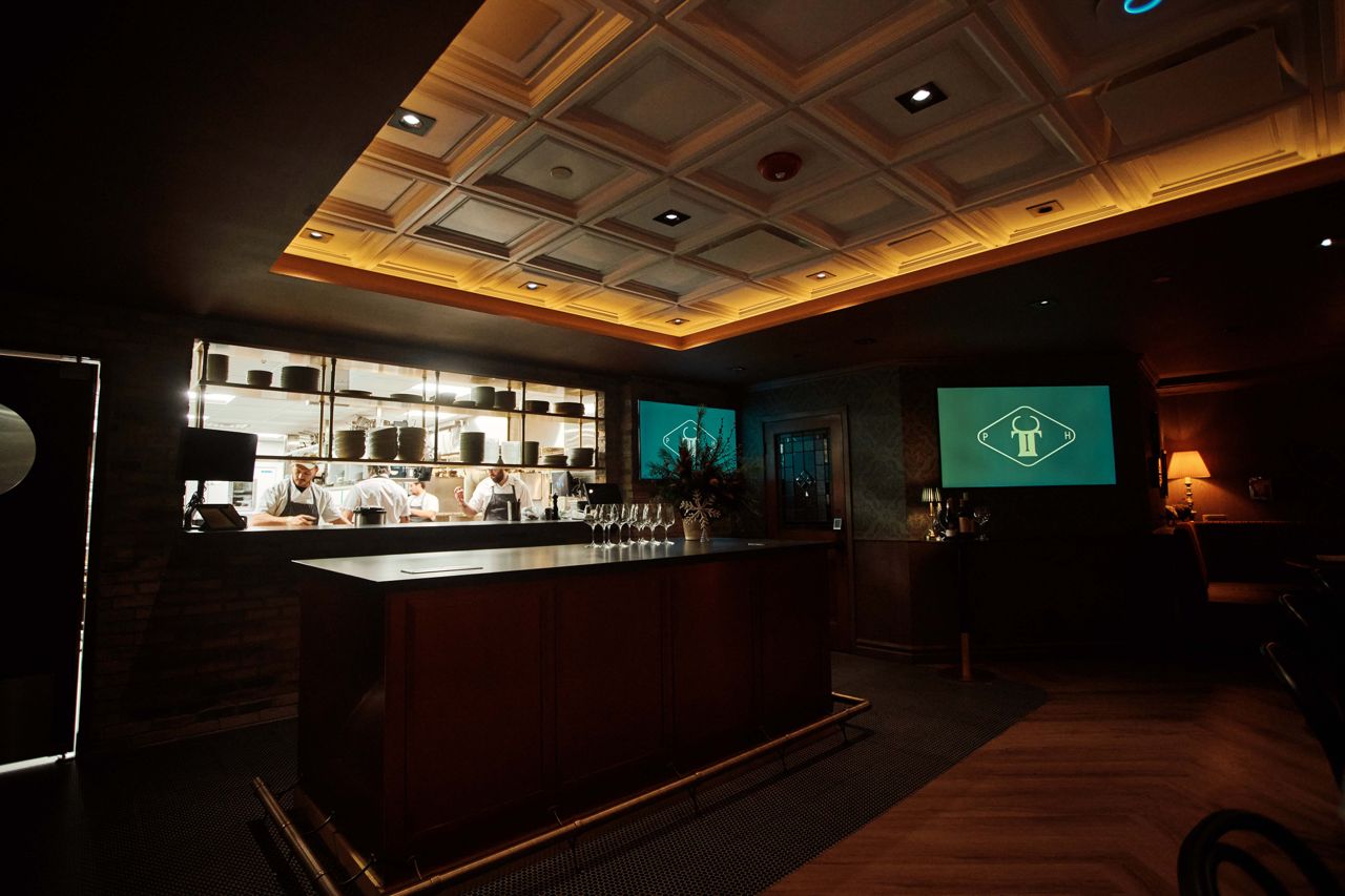 A look into the Iron Cow Public House kitchen from the dining room