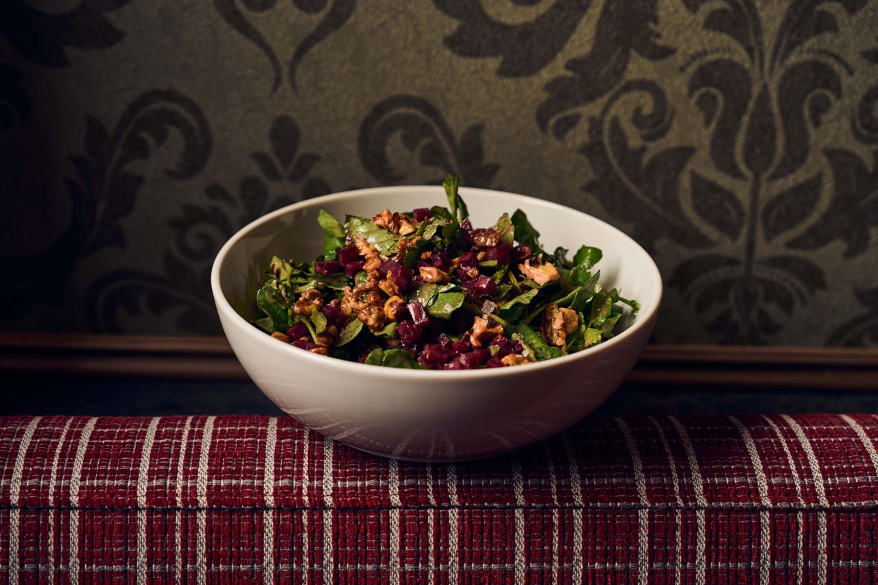 Riffing on a roasted beet and goat cheese plate, this salad layers peppery watercress with chunks of sweet and earthy oven-roasted beets and cubes of house-pickled beets