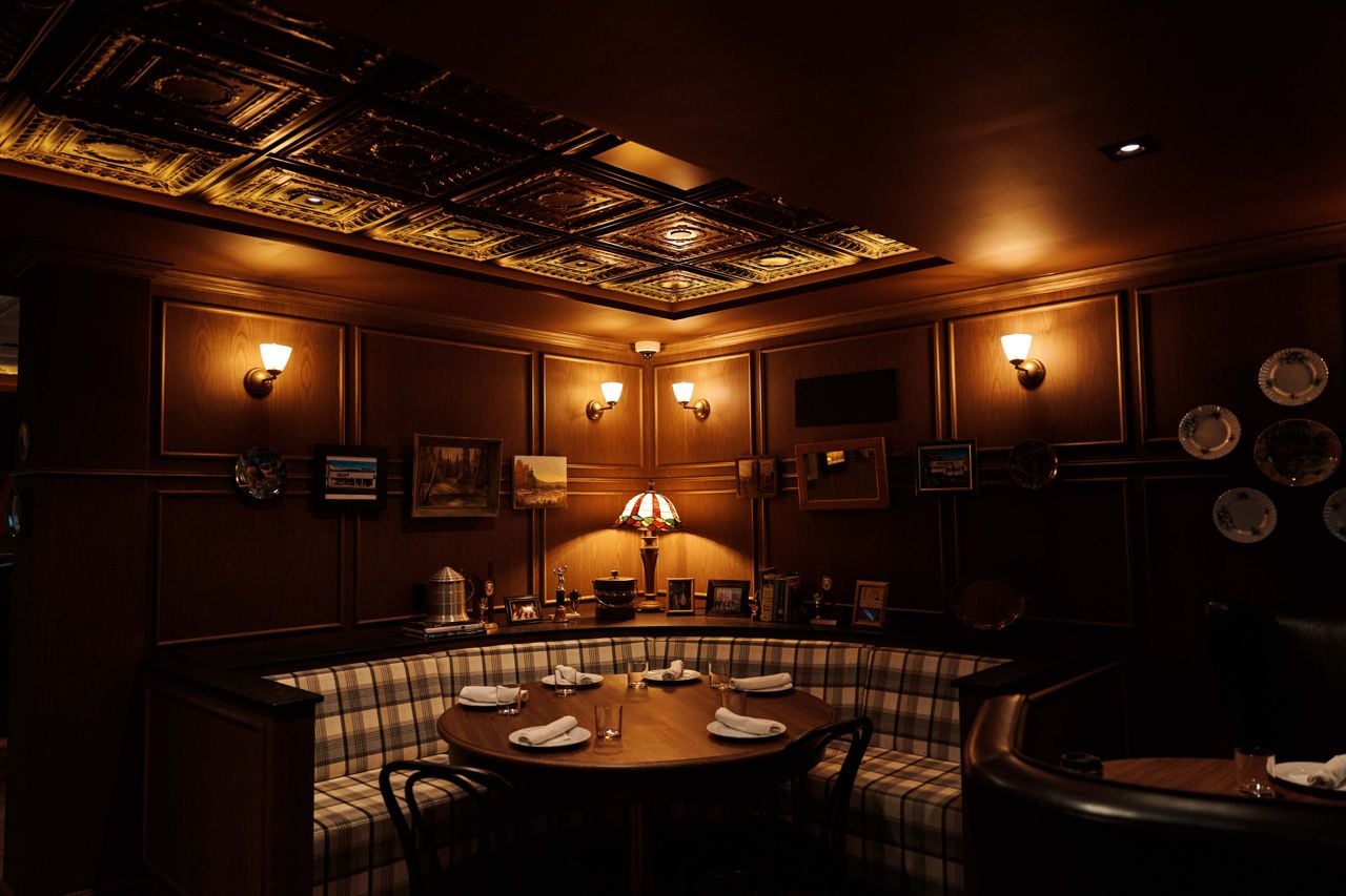 A large corner booth at the Iron Cow Public House
