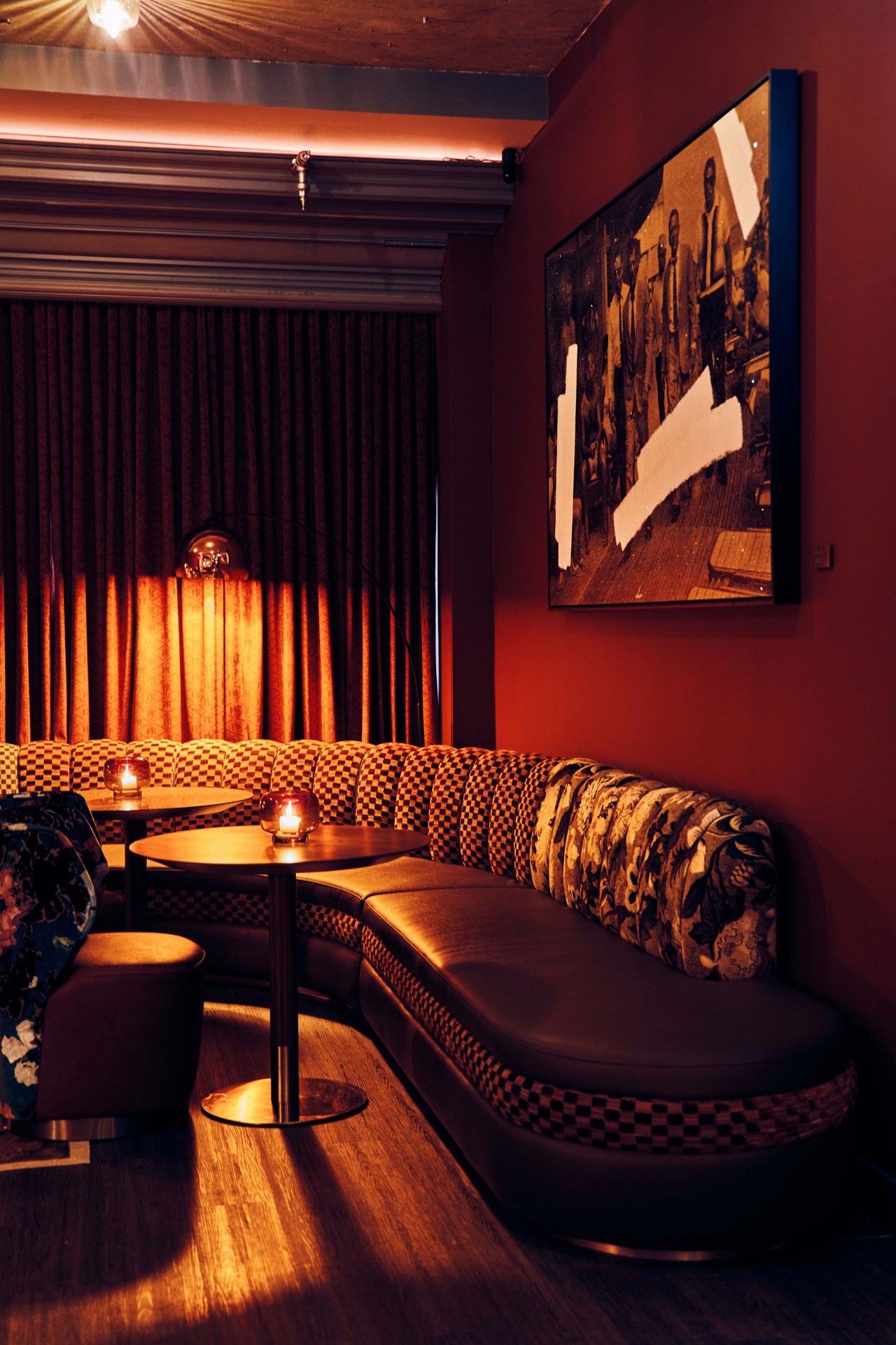 A corner booth inside the Powder Room