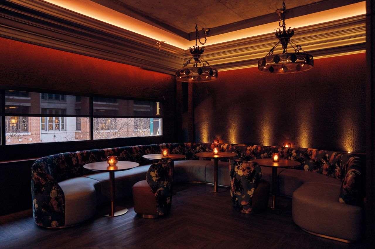A large horseshoe-shaped booth at the Powder Room