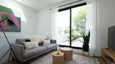 This Riverdale laneway suite has a rental unit up top and a carport down below