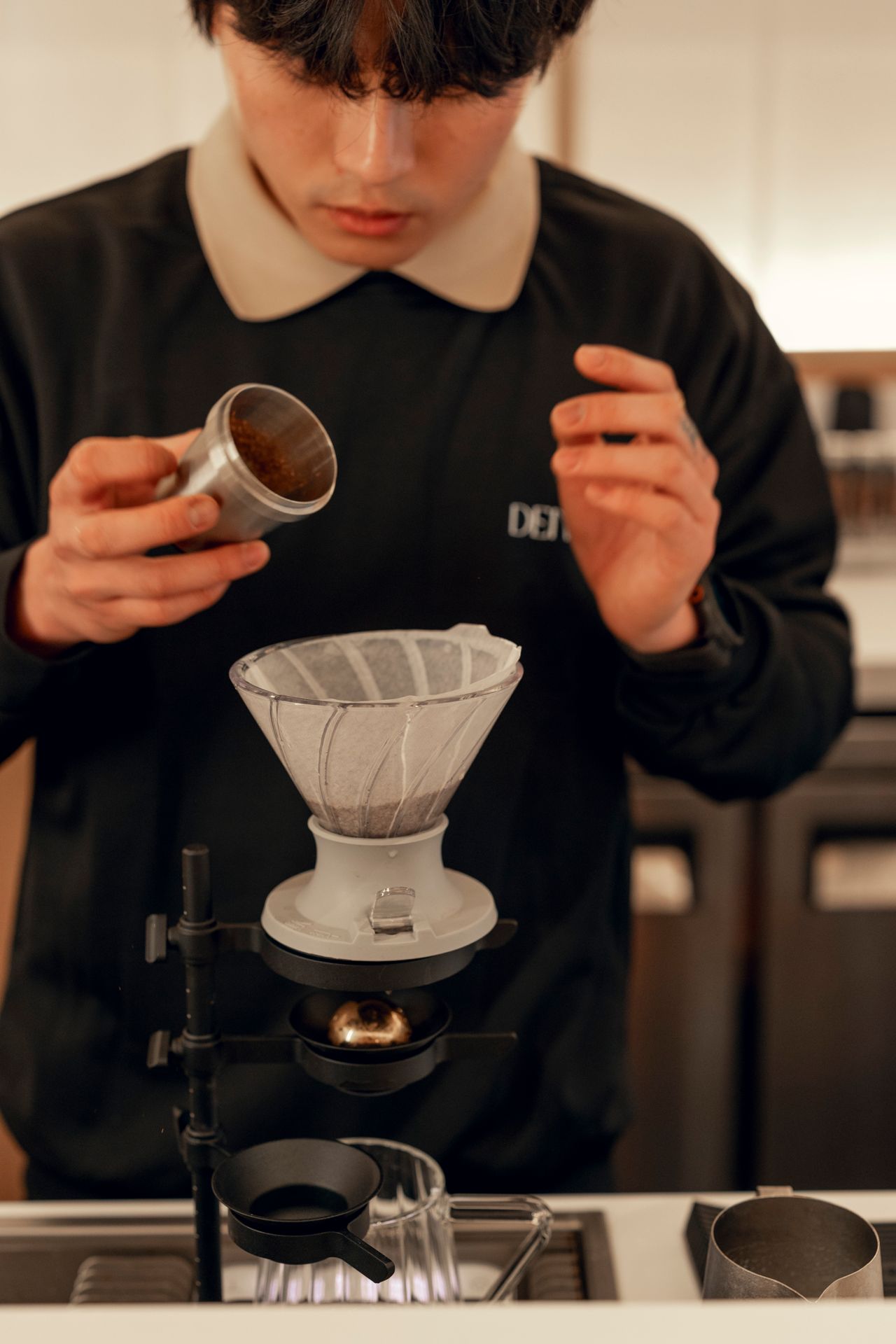 A barista makes coffee at Denovia, a café and wellness centre in Toronto