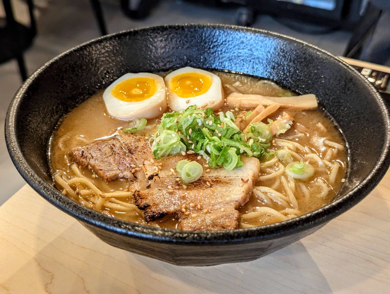 A closeup of a bowl of ajitama ramen