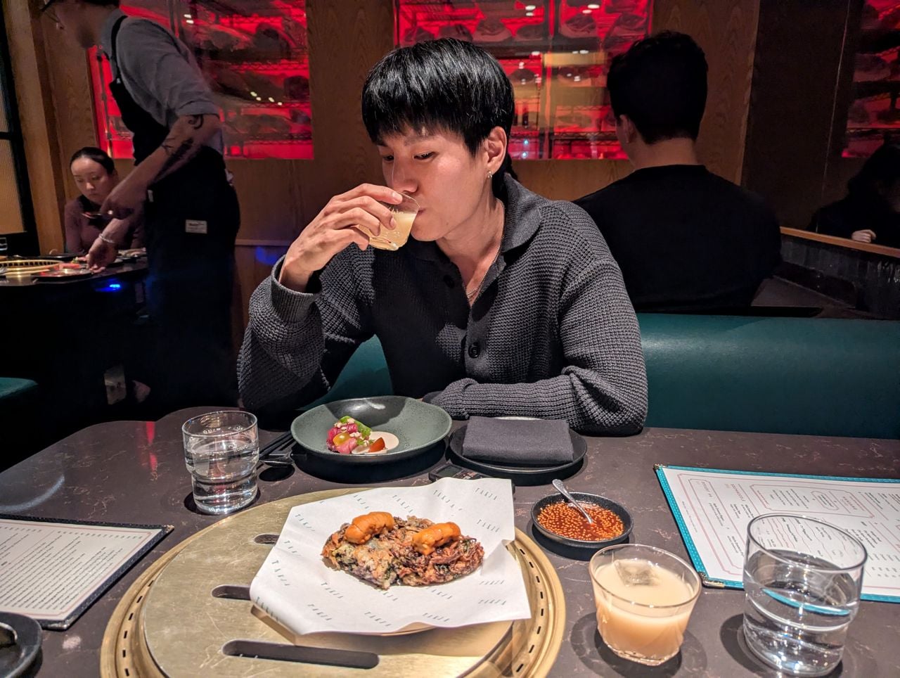 Chef Jayden Park sips makgeolli at a Korea barbecue restaurant