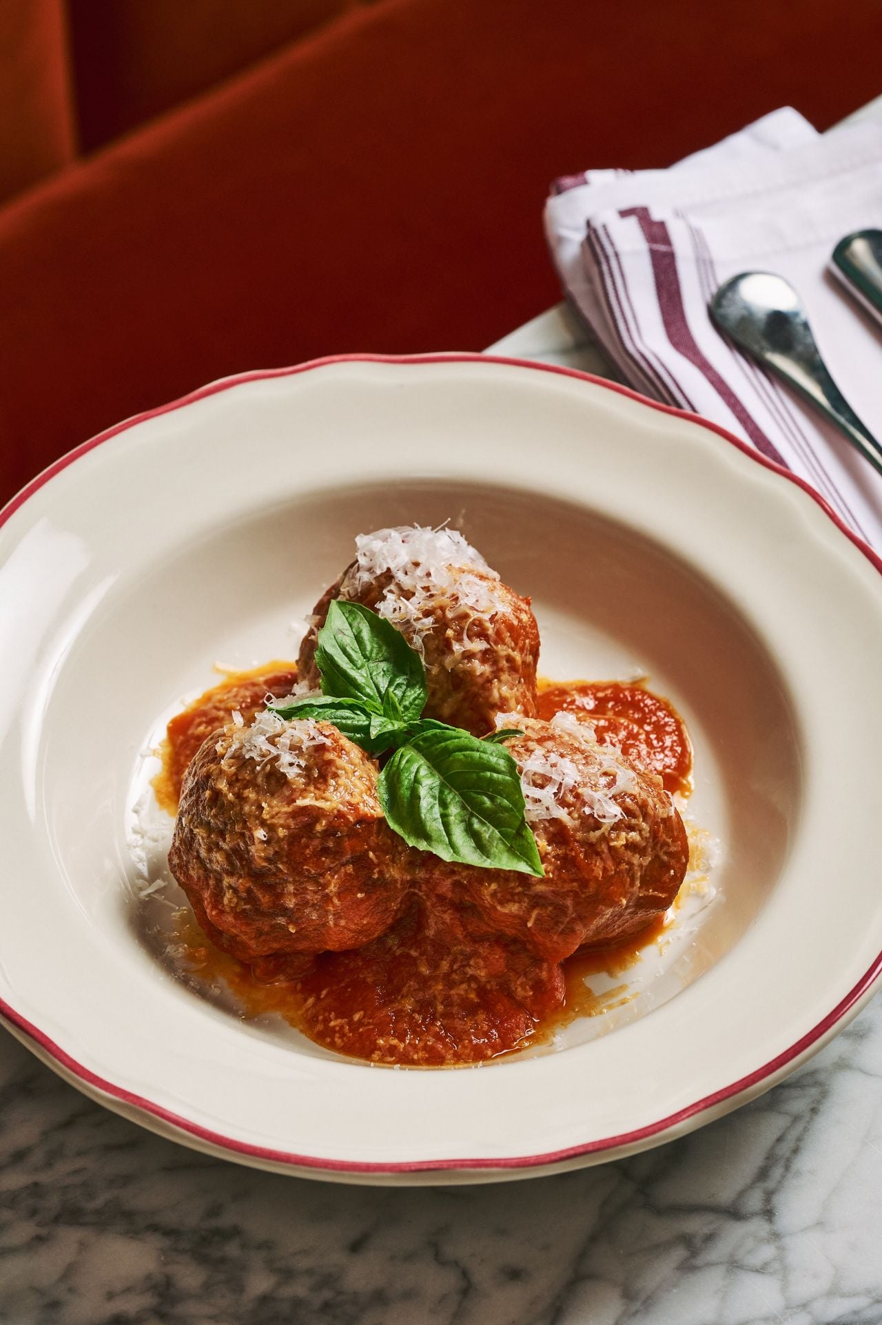 Italian meatballs topped with basil