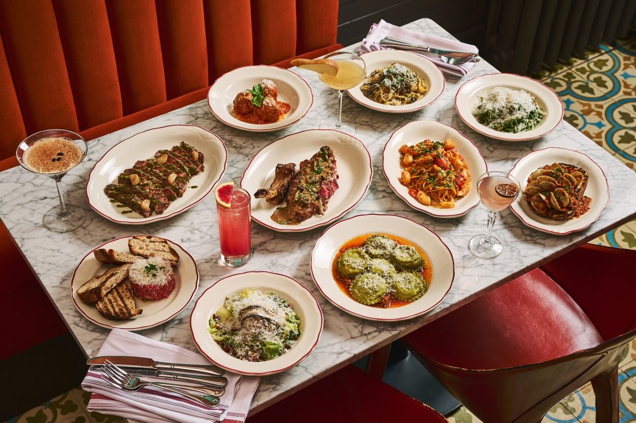 A spread of dishes and drinks at Proper