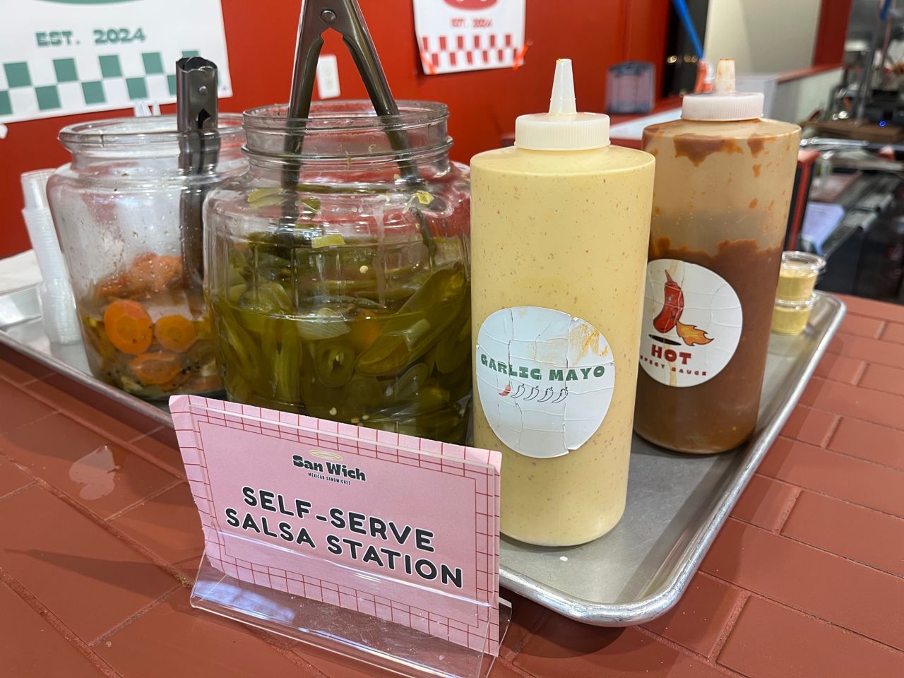 A tray of condiments at San Wich