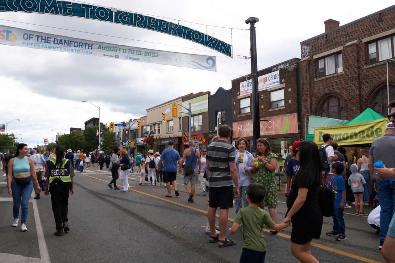 People walking in Greektown in Toronto