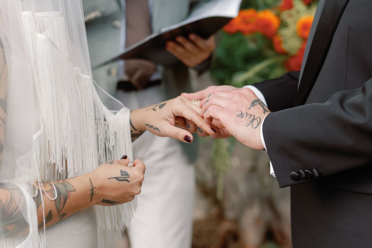 Inside a disco rodeo–themed wedding at a log cabin