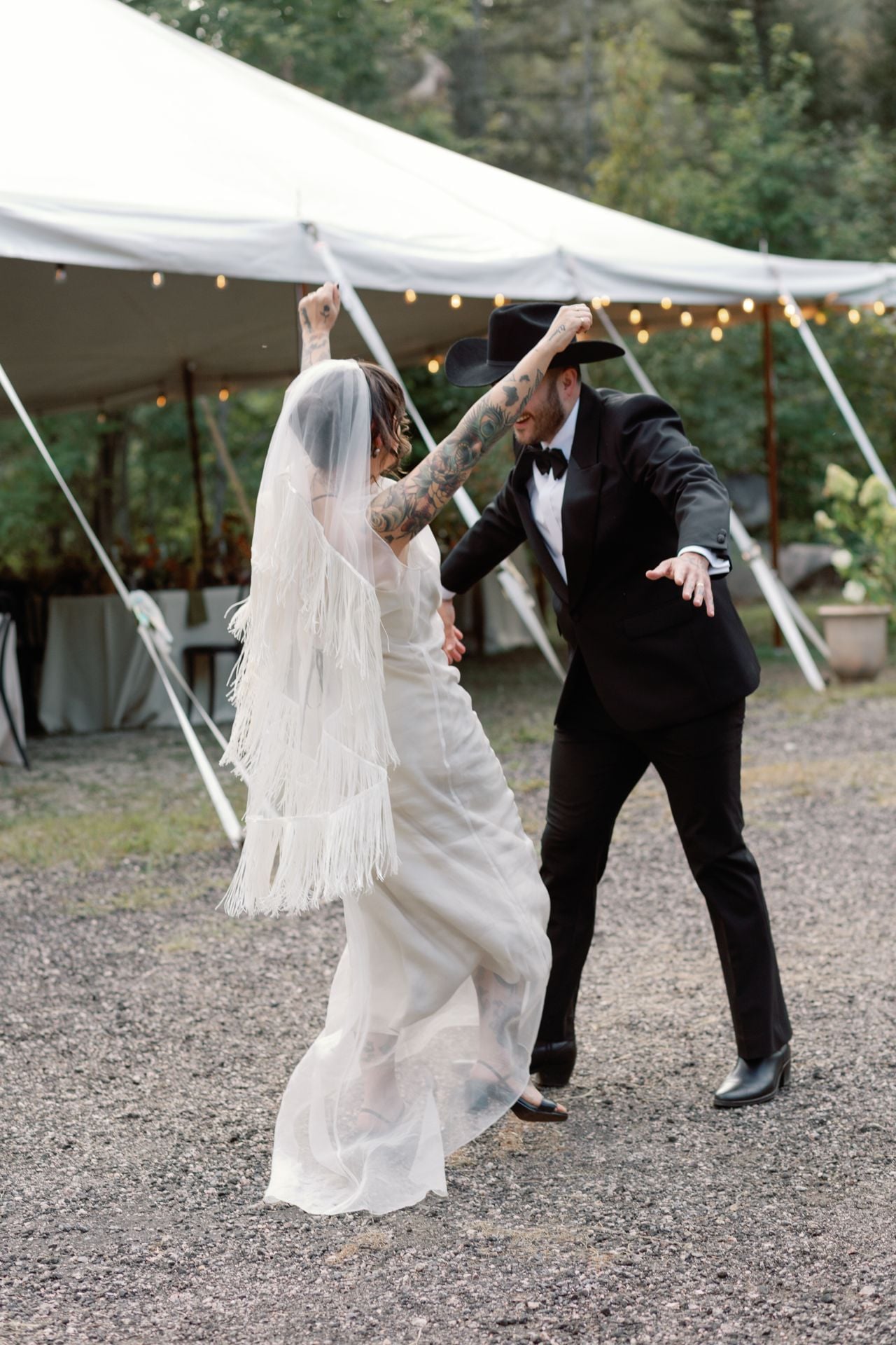 Inside a disco rodeo–themed wedding at a log cabin