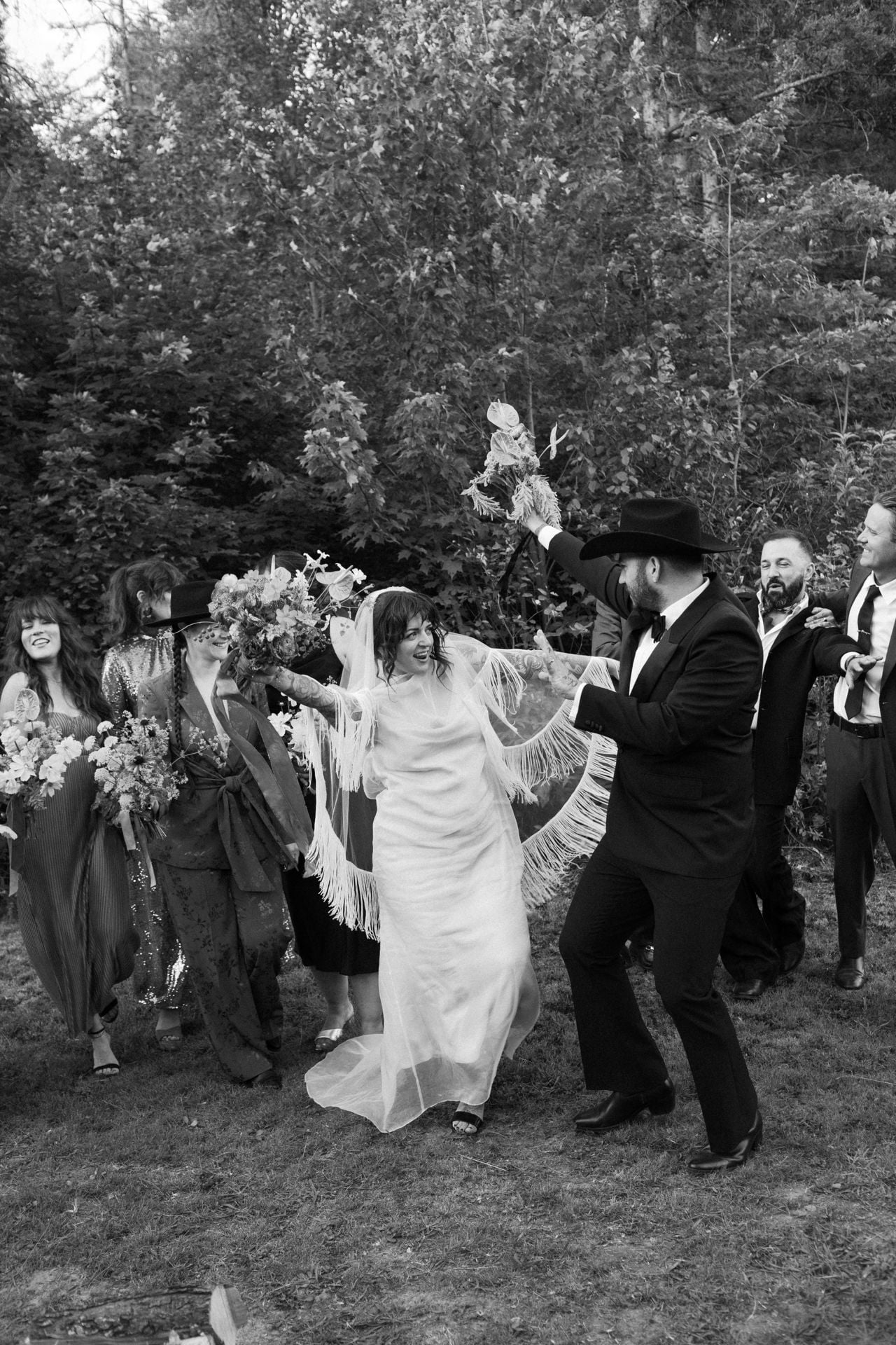 Inside a disco rodeo–themed wedding at a log cabin