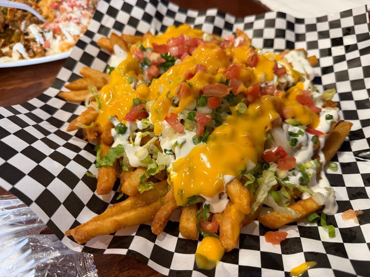 An order of fries supreme at Contigo Taco Bar