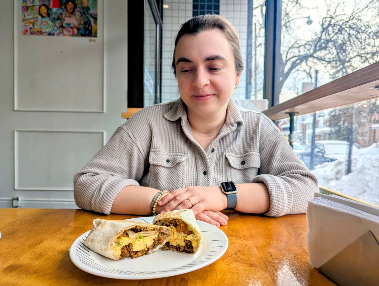 Chef Shauna Godfrey looks at a breakfast burrito at Masa Deli