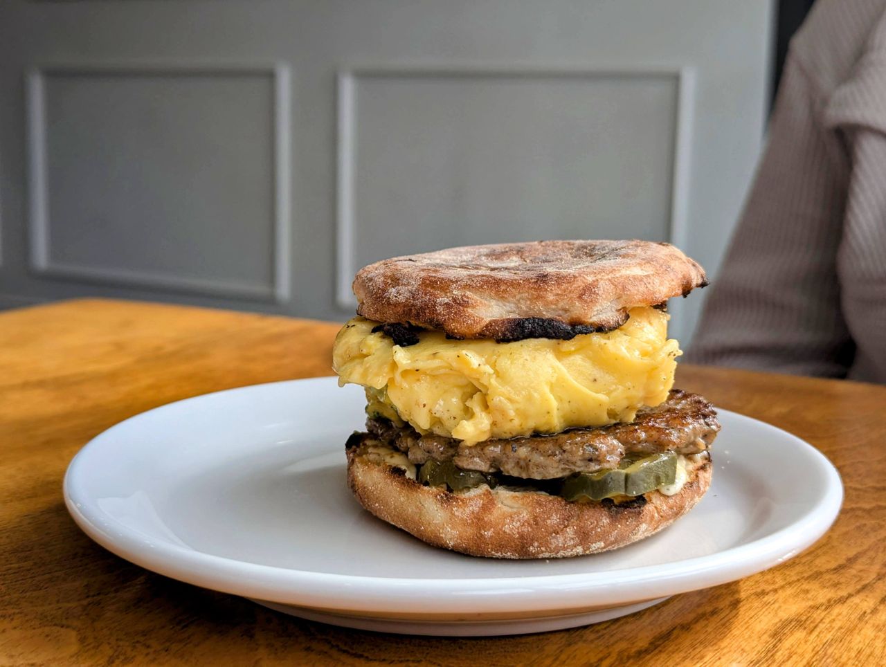 A sausage-and-egg breakfast sandwich at Masa Deli