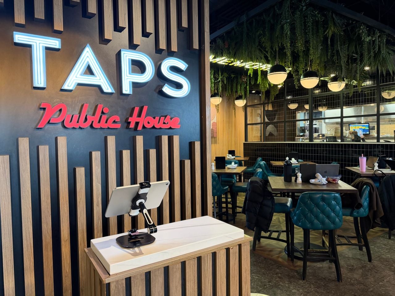 The host stand and dining room at Taps Public House