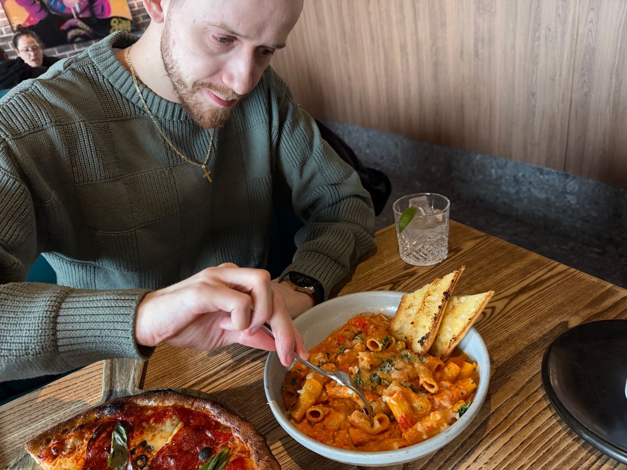 Chef Robert Balint digs into the rigatoni alla vodka at Taps Public House