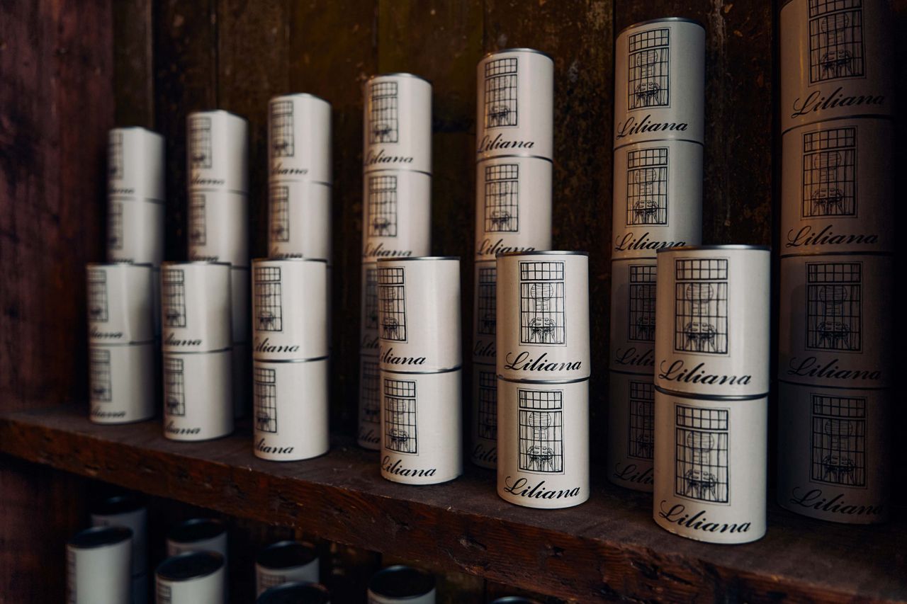 A shelf lined with stacked cans