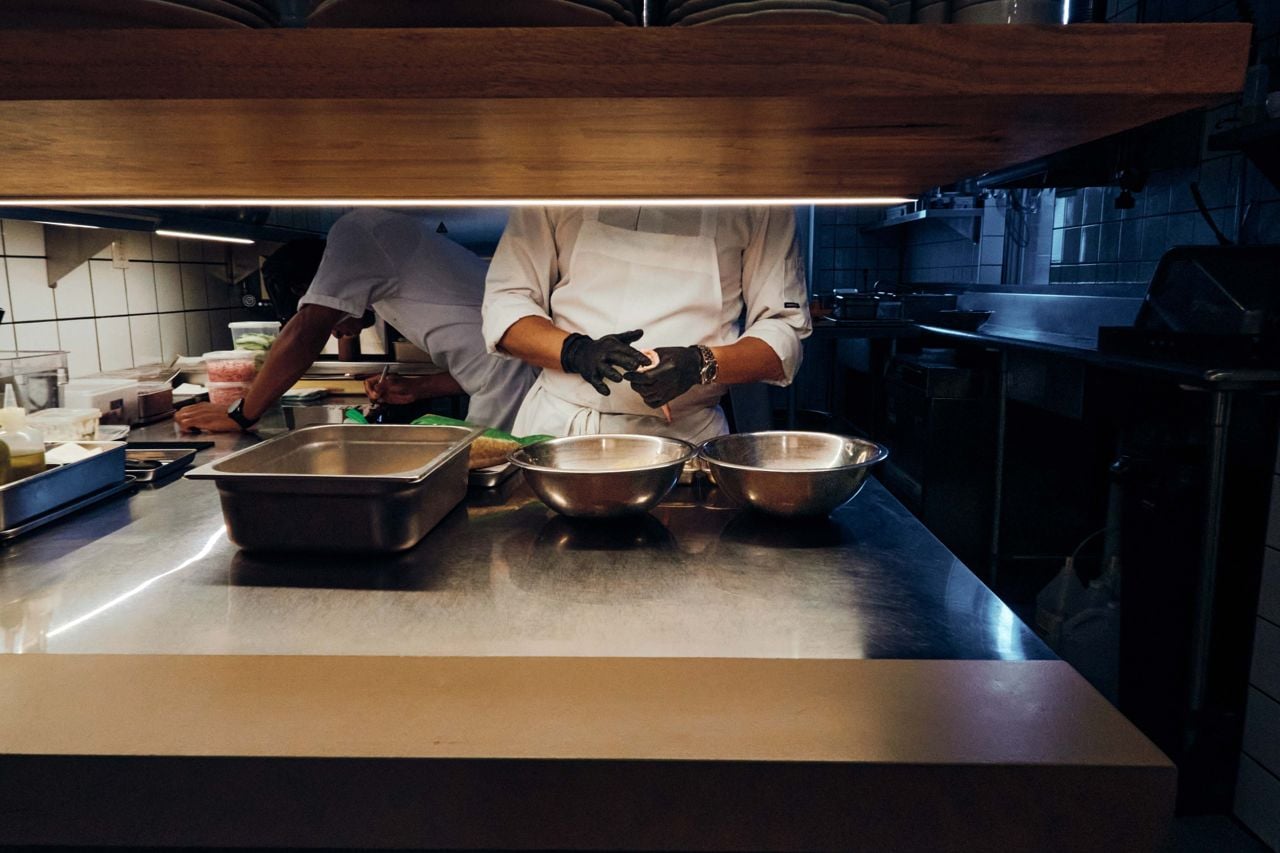 Looking into the open kitchen at Liliana, where chefs are at work