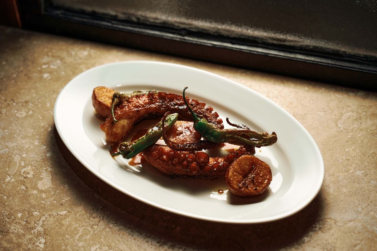Steamed and fried octopus tentacles with shishito peppers