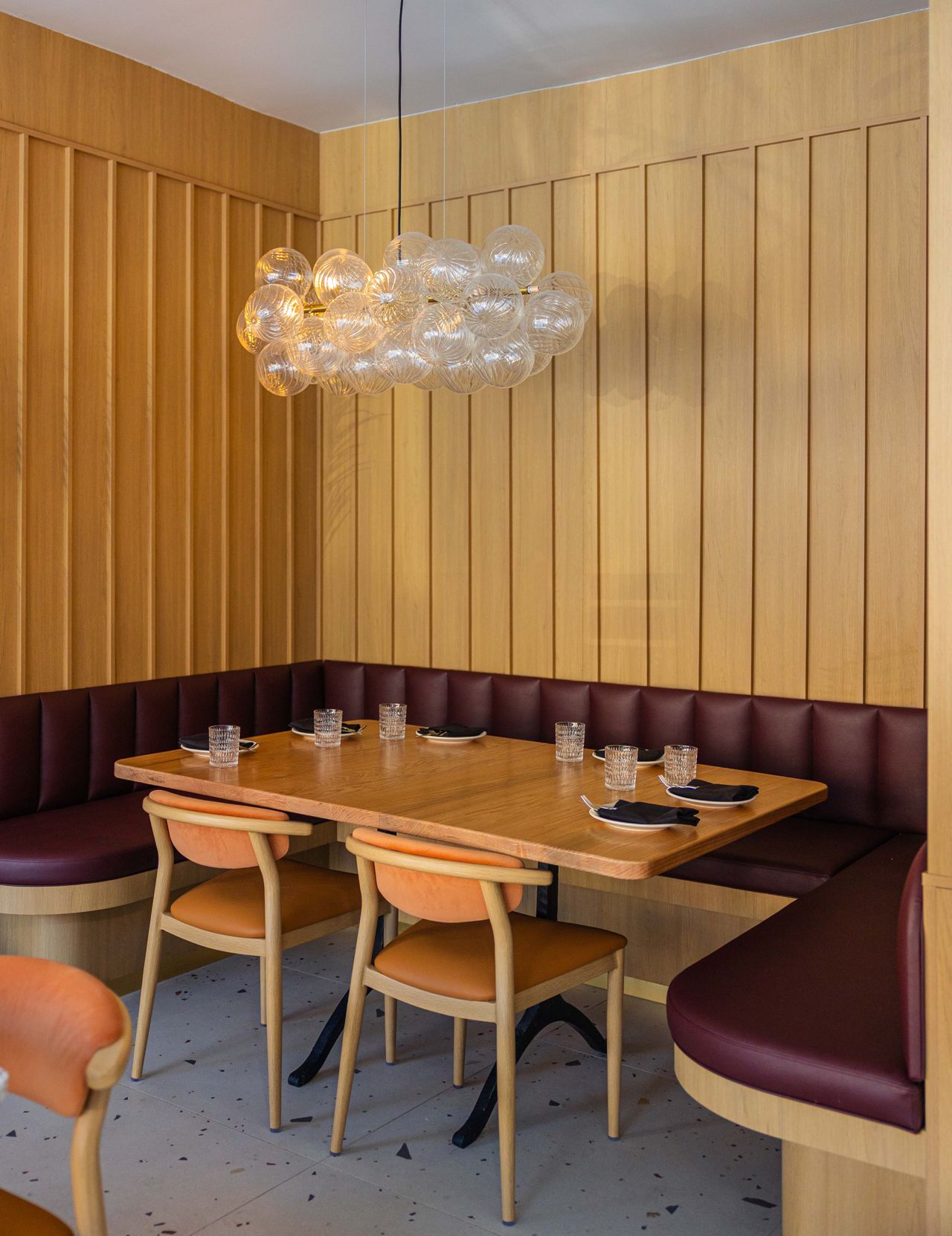 A booth in the back of Osteria Alba's dining room