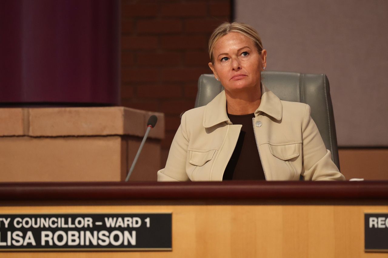 Pickering City Councillor Lisa Robinson sits at her council seat.