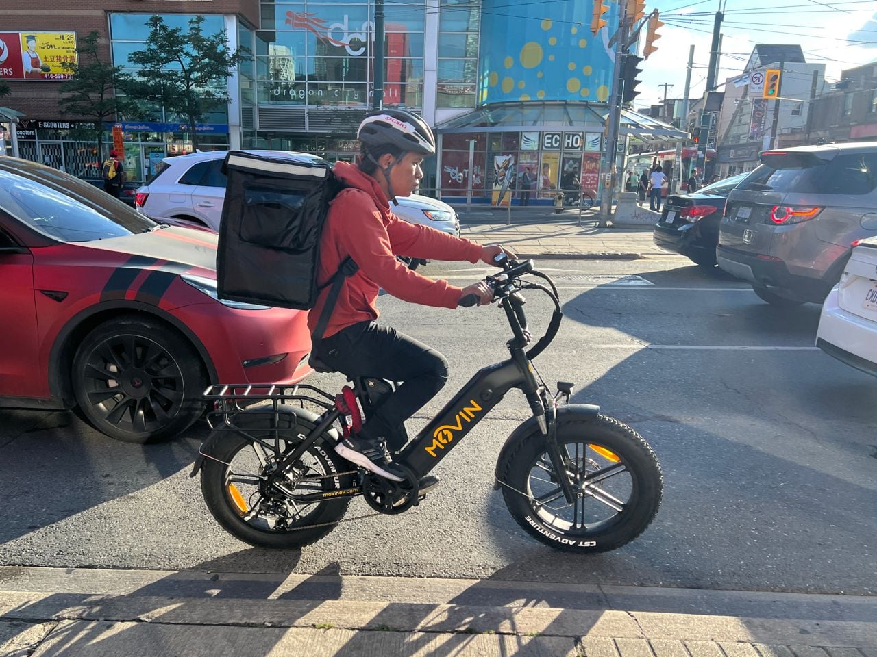 A food delivery driver is delivering a food order in Toronto, Ontario, Canada.