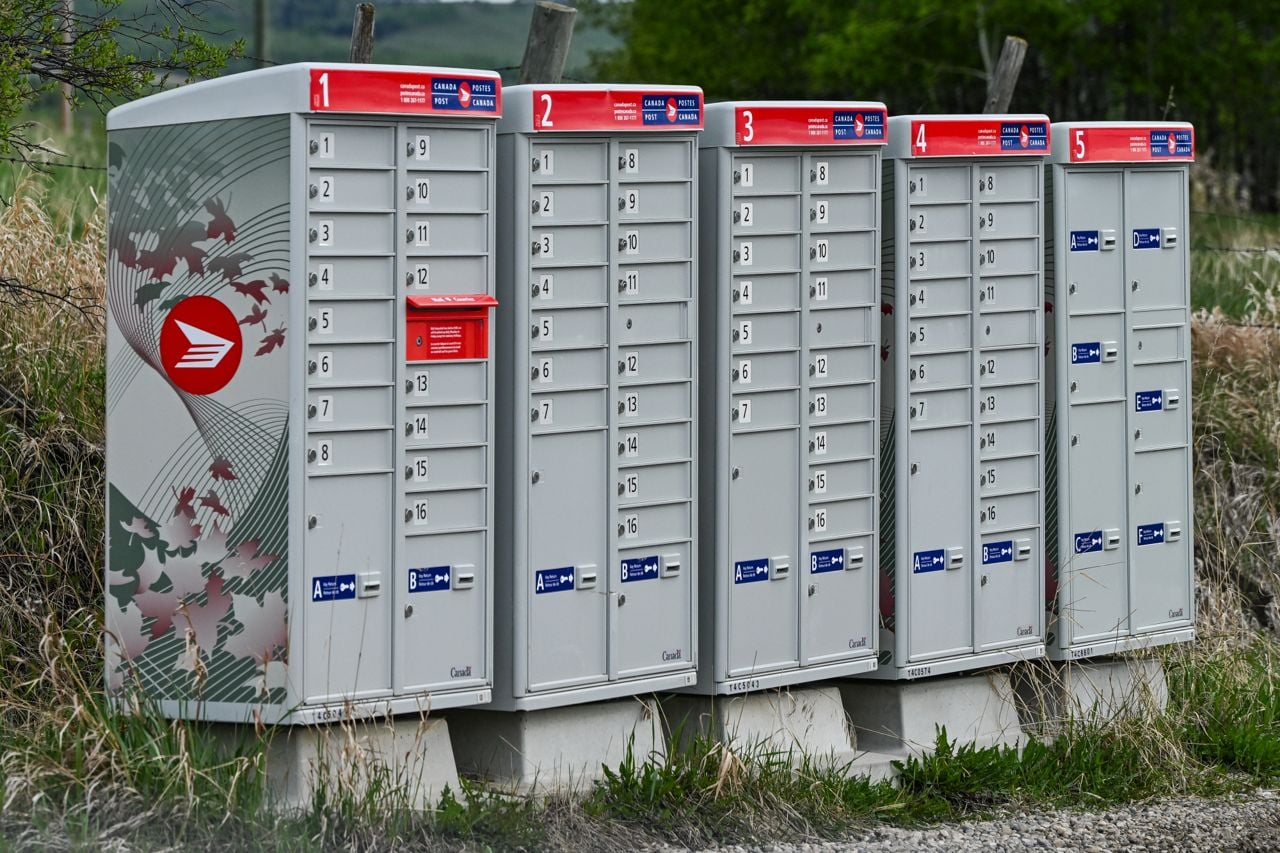 A line of Canada Post mailboxes is seen along Highway 22, known as the Cowboy Trail, between Cochrane and Cremona in Alberta, Canada, on May 22, 2025.