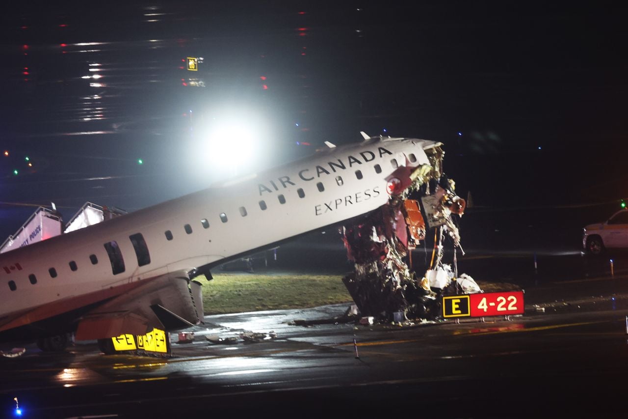 An Air Canada Express plane sits on the tarmac after it collided with a fire truck on the tarmac at LaGuardia Airport on March 23, 2026 in New York City. The plane had landed from a flight from Montreal.