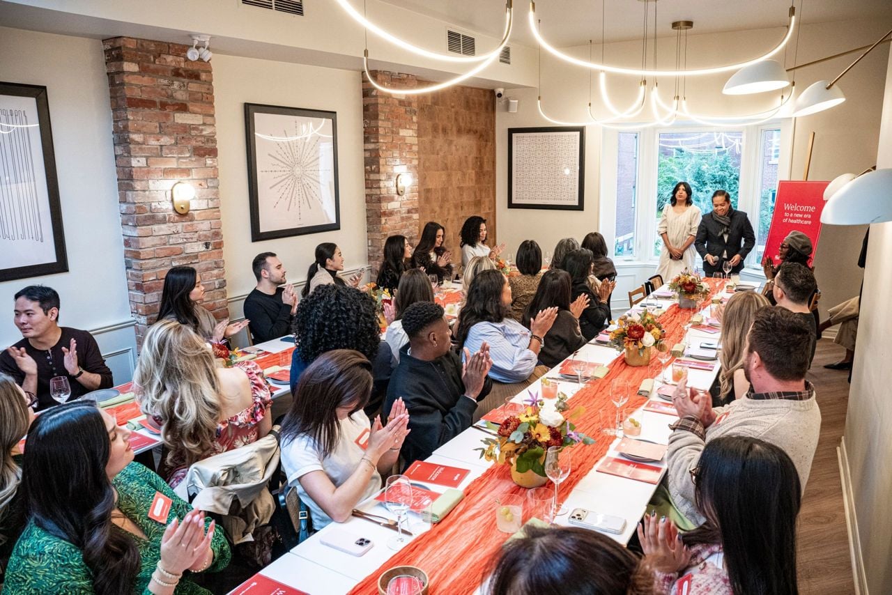 People clapping at a table