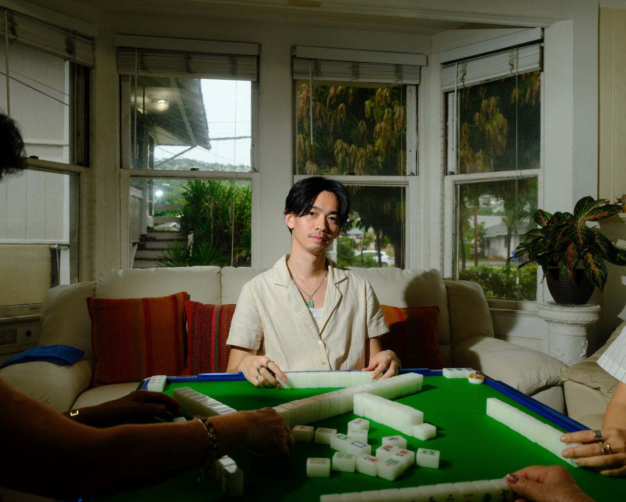 Man playing mahjong at a table