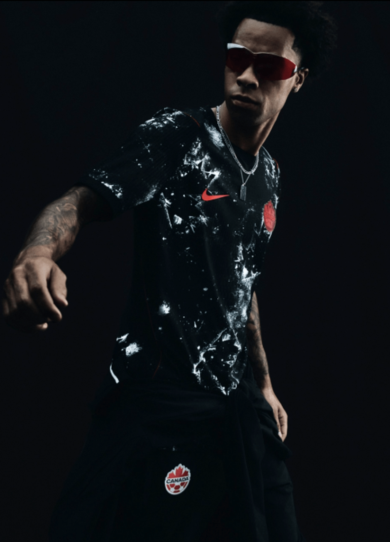 A model wears the Canada men's soccer team's 2026 away game jersey.