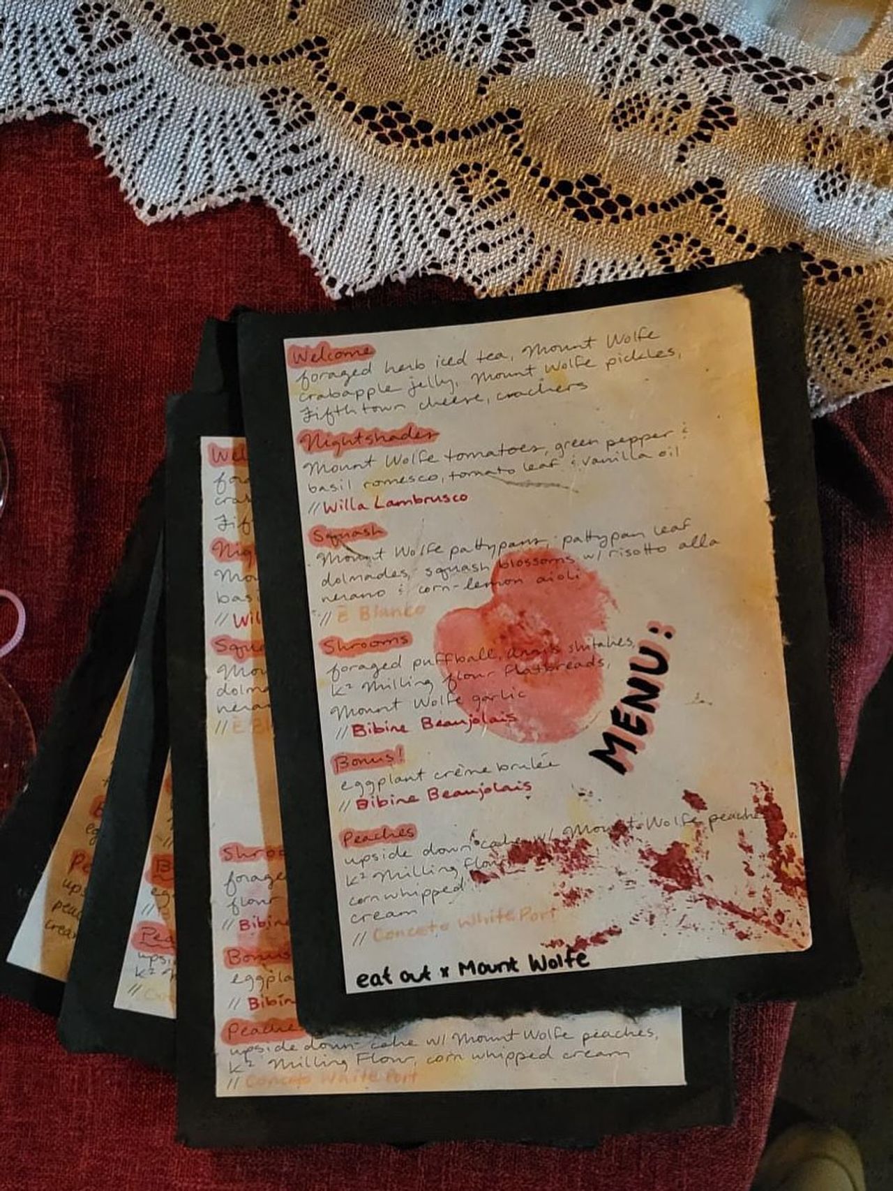 A stack of menus for Eat Out Supper Club