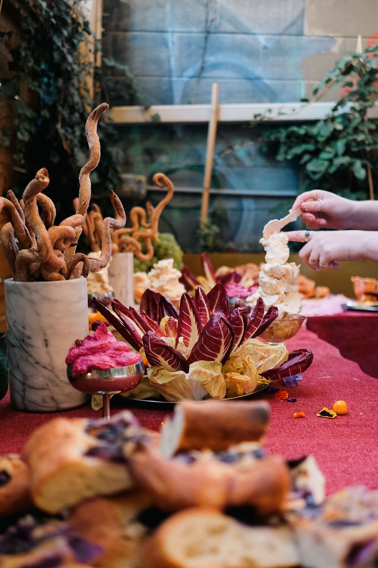 A spread of snacks and dips on a table