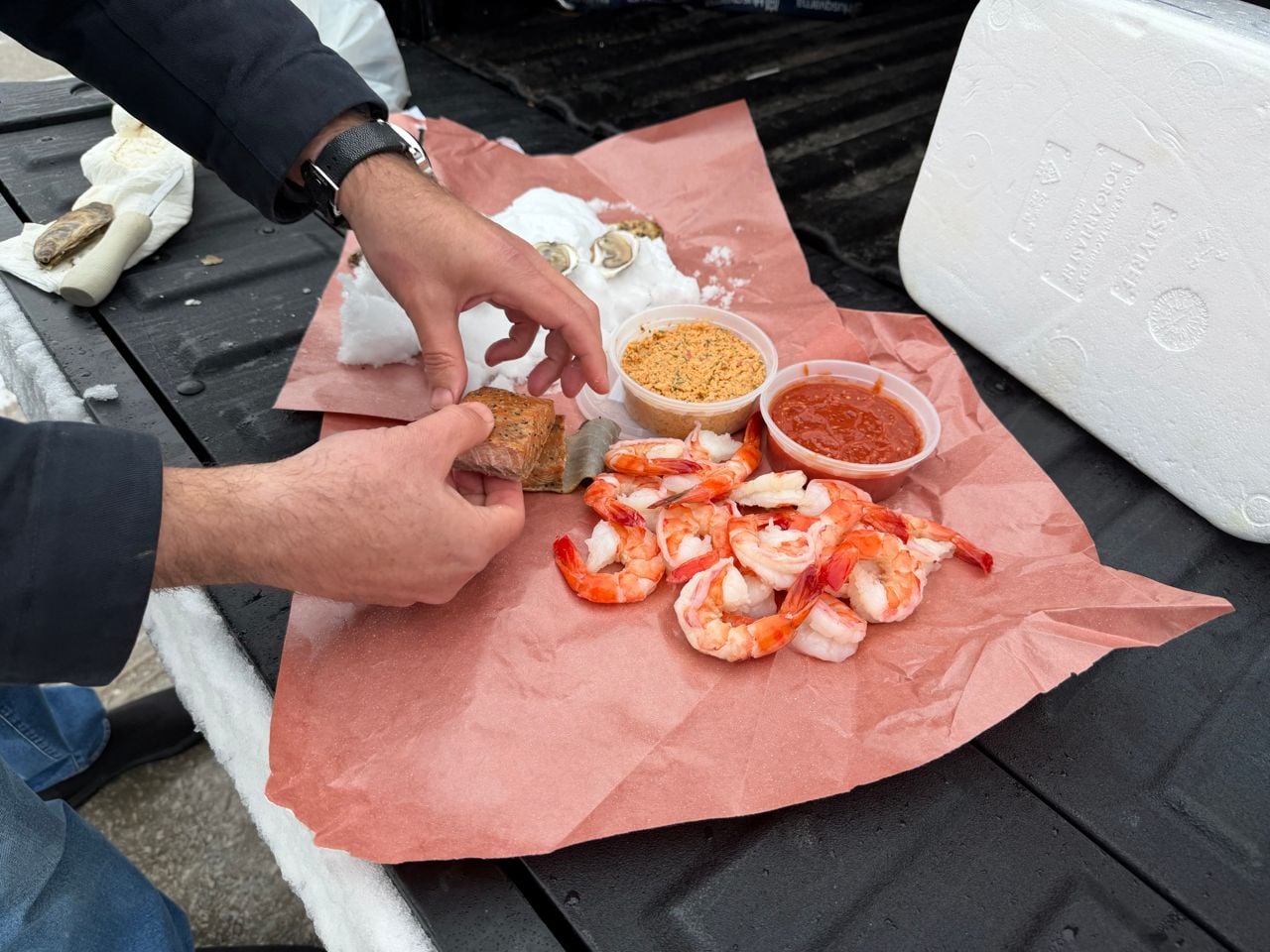 A spread of seafood including shrimp, oysters and smoked salmon