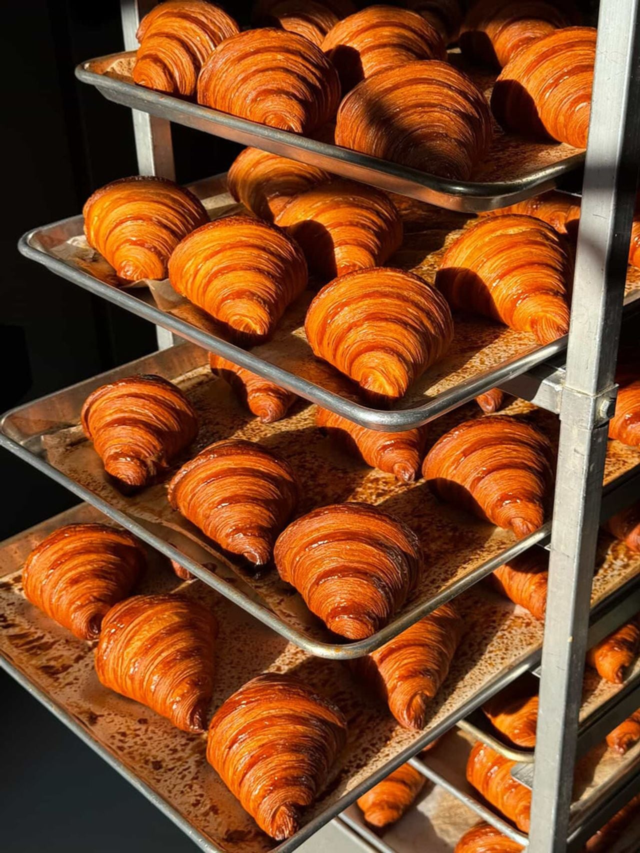Trays of freshly baked croissants