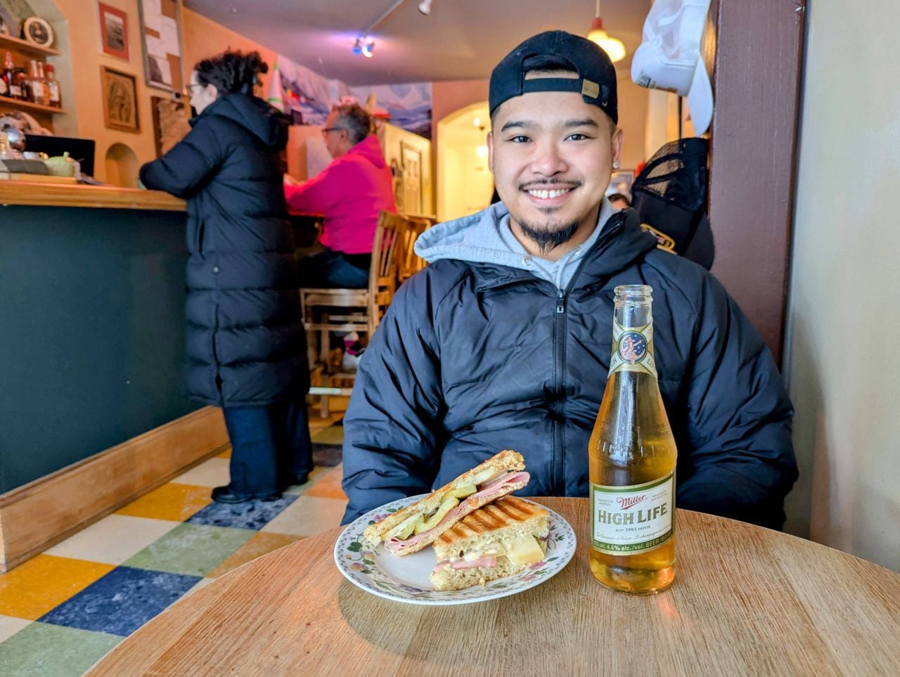 Chef Julian Cawagas, with a Cubano and Miller High Life, at Osprey Cafe in Toronto