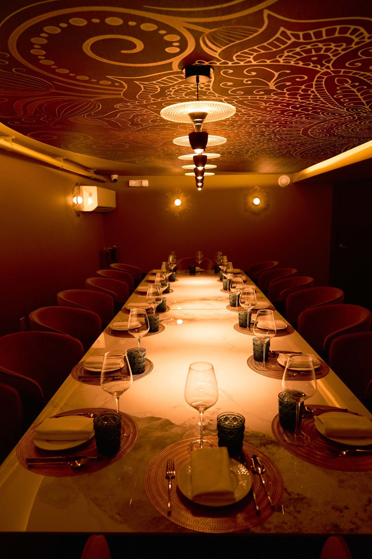 The private dining room at Aagan, with an elaborate painted ceiling