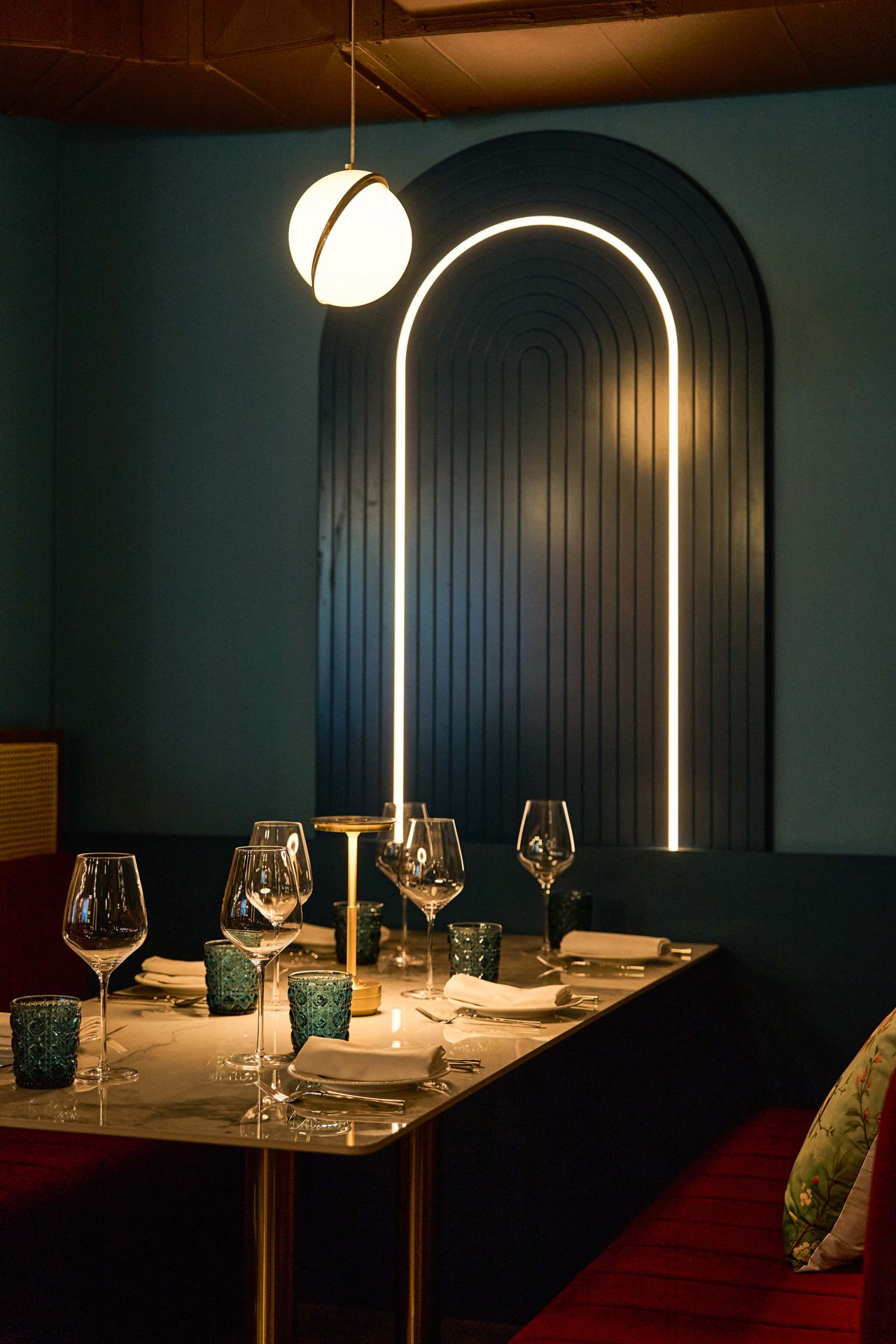 A velvet booth in Aangan's dining room