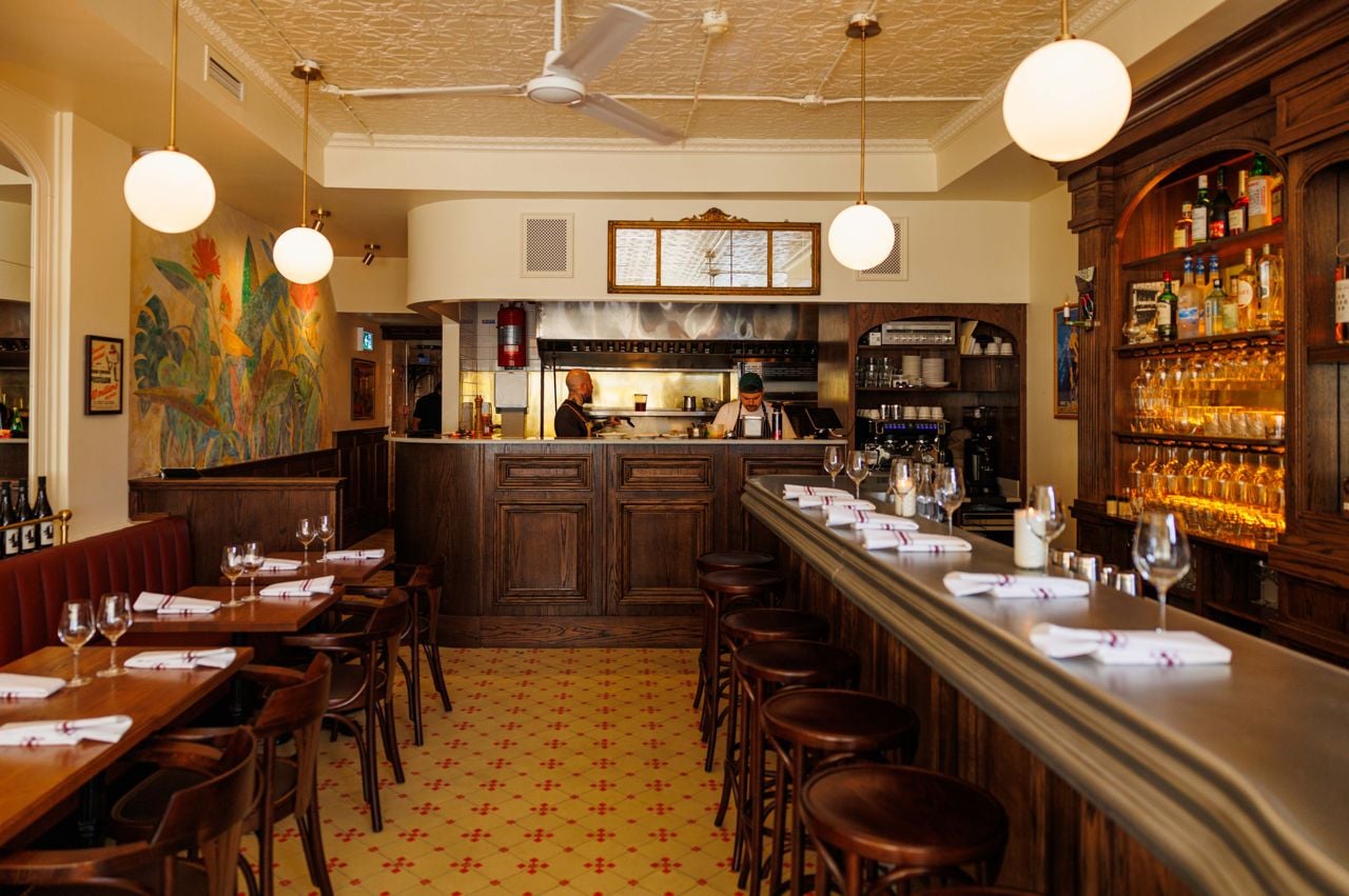 Looking from the front of Brasserie Côte's dining room to the back where the open kitchen is