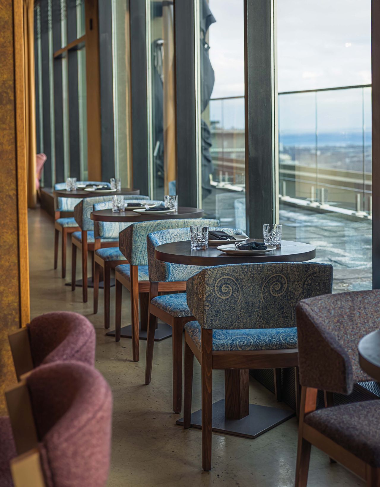 Tables for two in the Mar'aa dining room, with views of Toronto's skyline