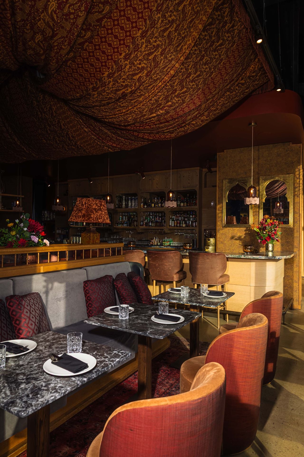 Fabric swaths drape from the ceiling in the Mar'aa dining room