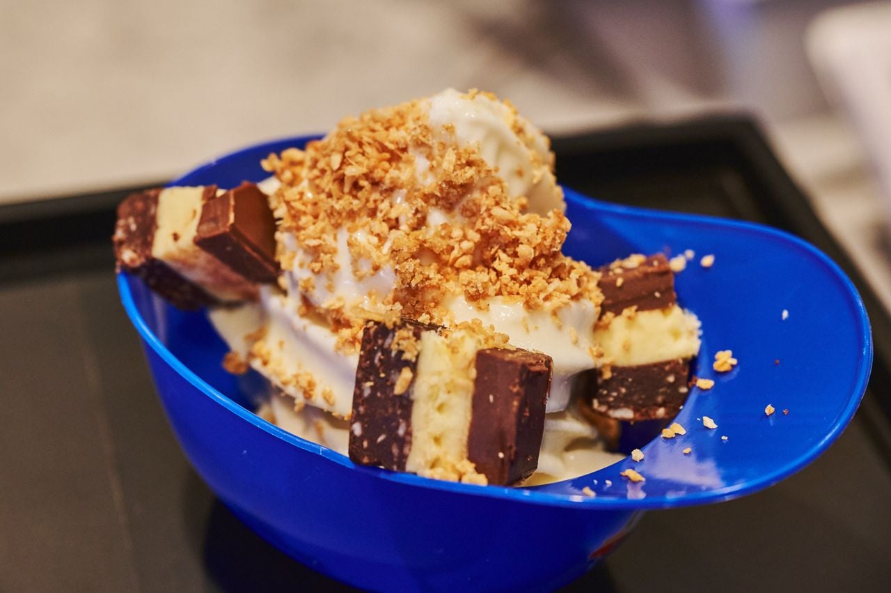 An ice cream sundae in a baseball cap bowl