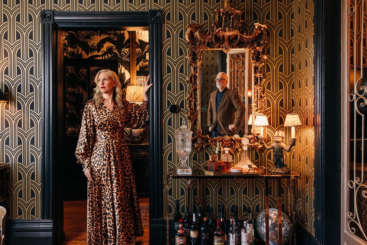 Woman and man in sumptuous hollywood regency digs