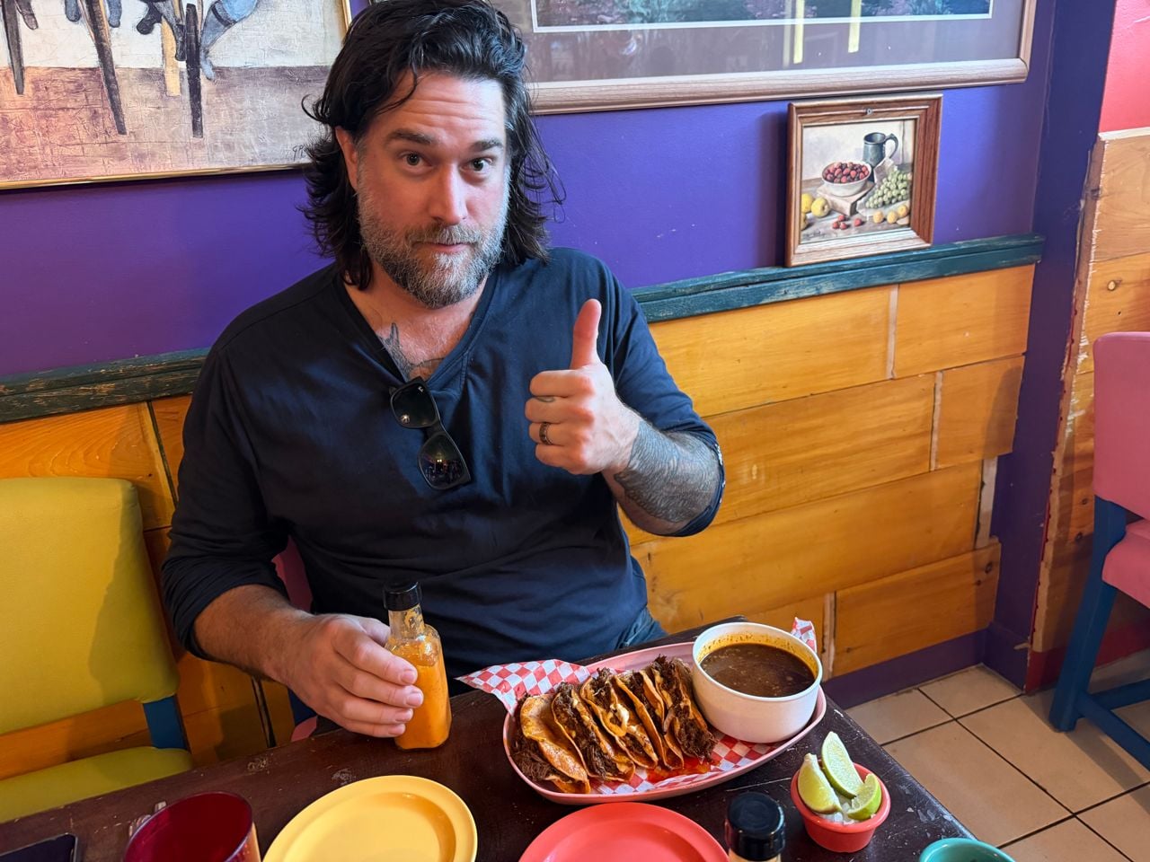 Chef Michael hunter gives the thumbs up to his tacos