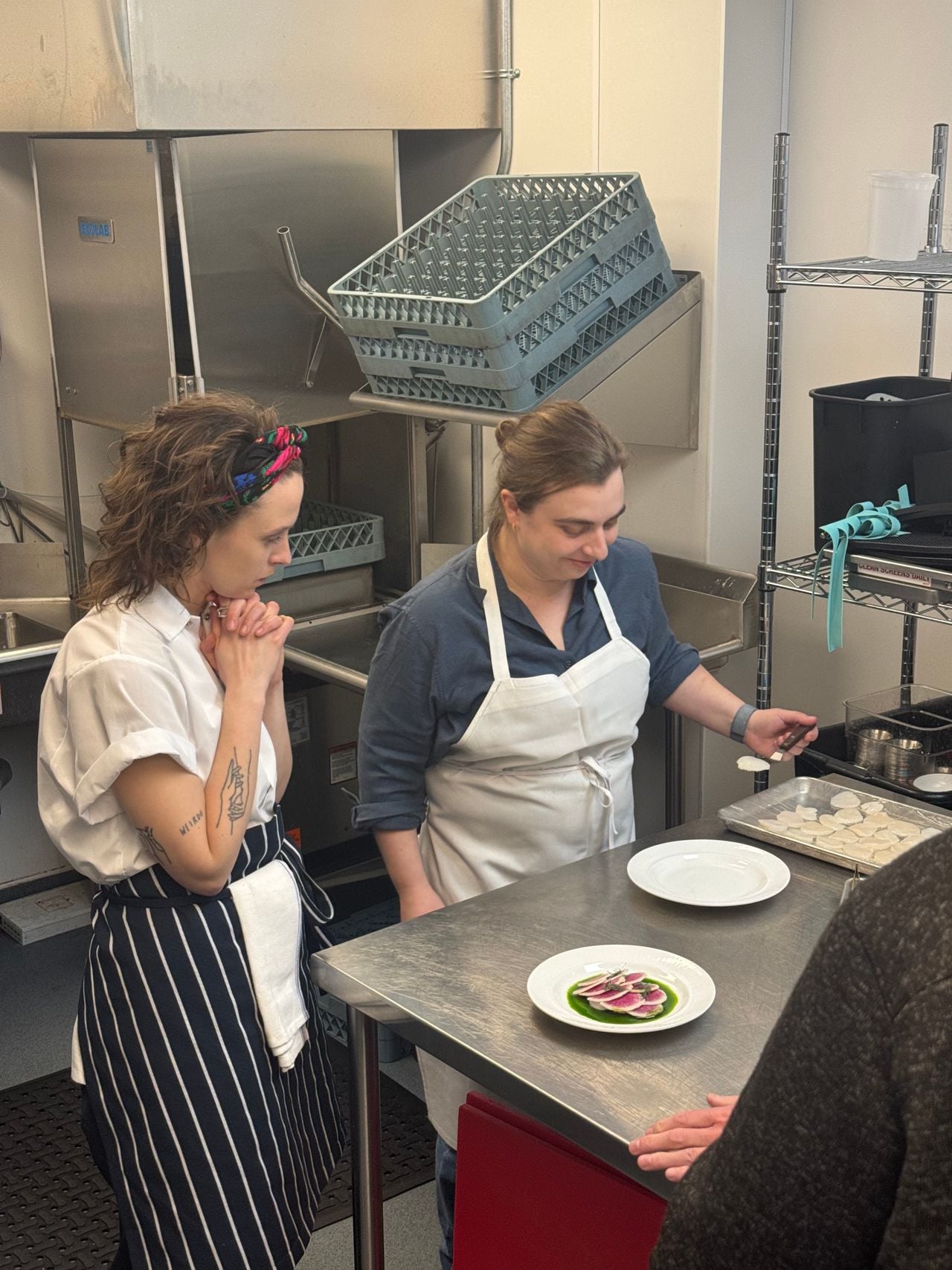 Chef Shauna Godfrey teaches an actor playing a chef how to plate a dish