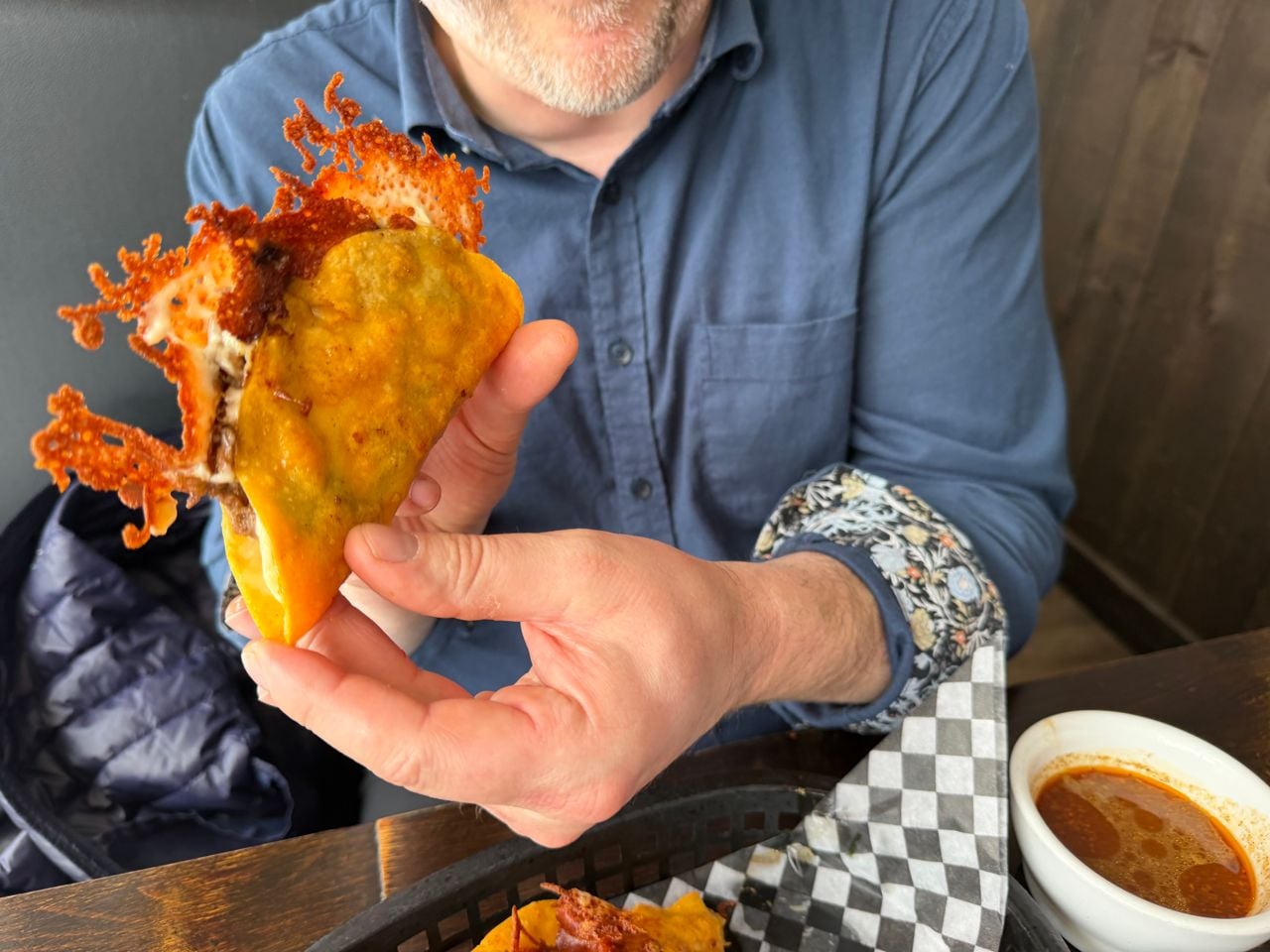 A closeup of a birria taco