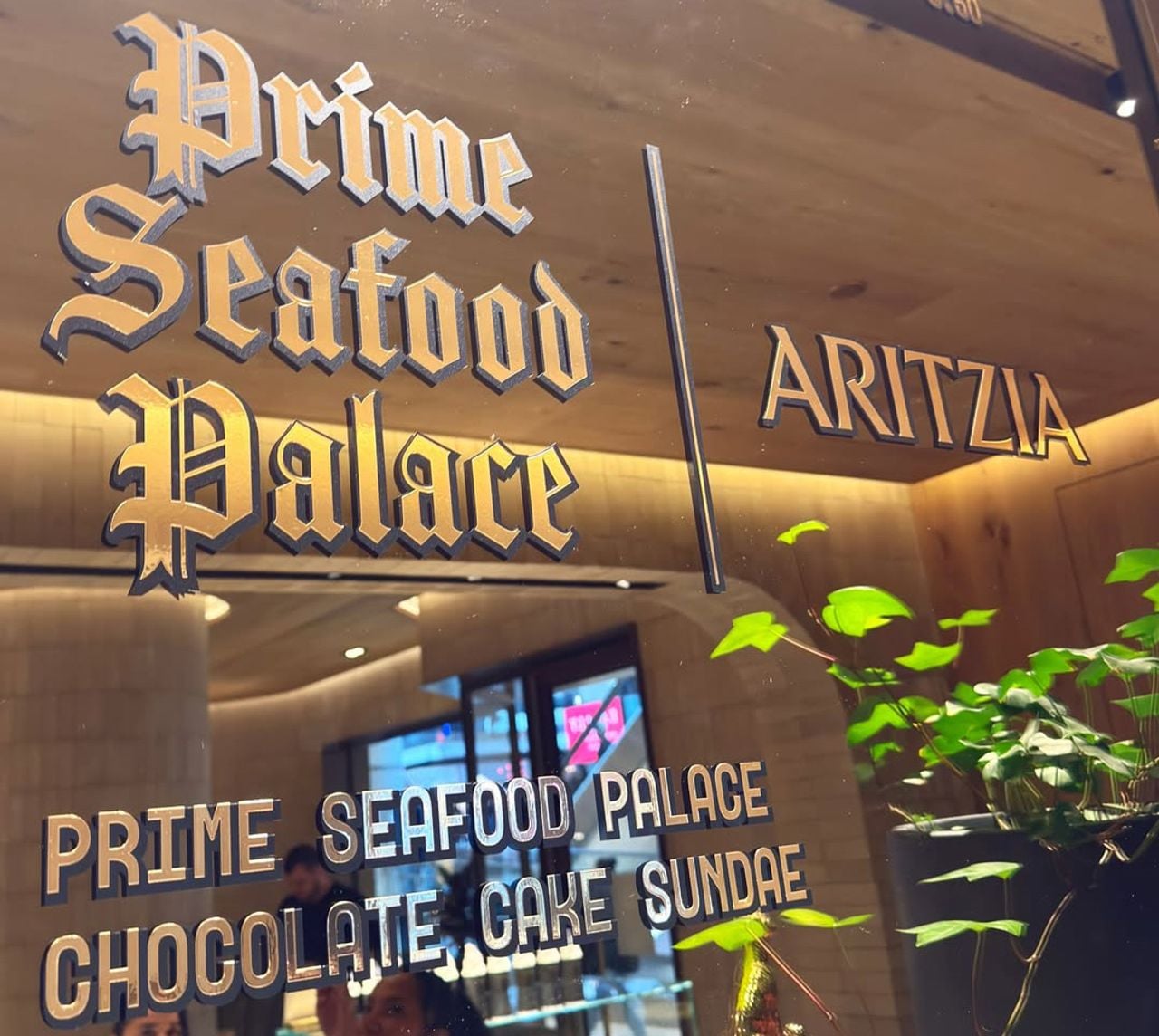A mirror displaying the Prime Seafood Palace and Aritzia sundae collaboration
